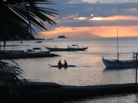 Dusk at Tamarind Beach, Anilao. Sombrero Island and Mindoro' Mount Kalawite can be seen at the far end.