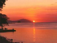 The setting sun at Point Kalawite as seen from Anilao.