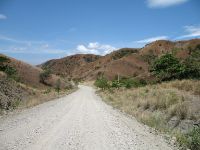 The roads from the southern third of the eastern road and the entire western road to Mamburao was unsurfaced and dusty.