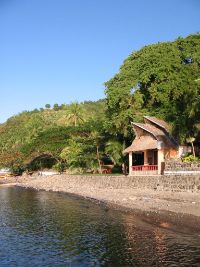 The picture shows the first version of the guest house. It was later rebuilt with a veranda upstairs fronting the sea.