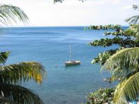 Wayfarer sailing dingy moored outside the beach.